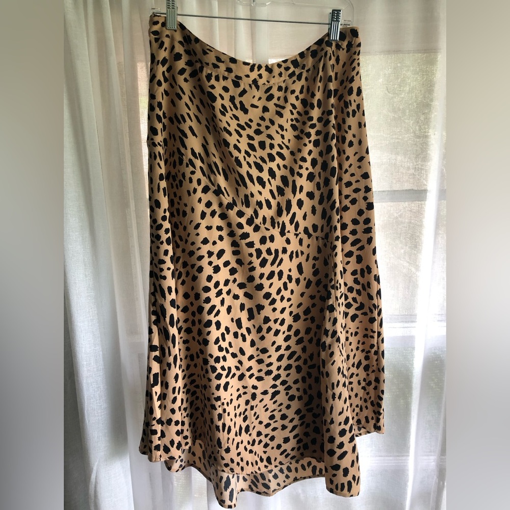 Cheeta print. Flowing and perfect for summer. Asymmetrical about 32 inches